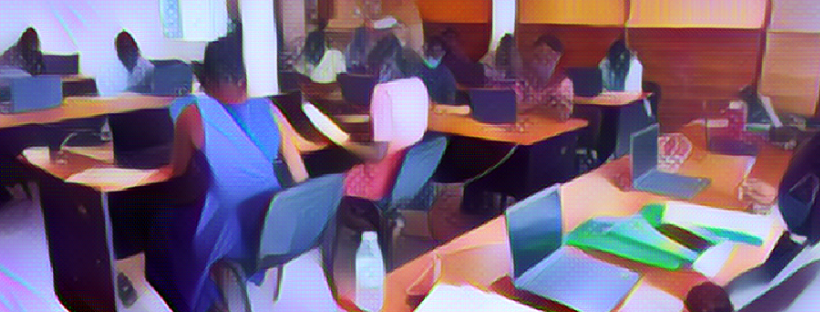 Students in a classroom sitting at individual tables